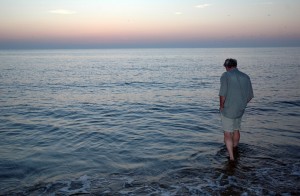 man-wading-ocean